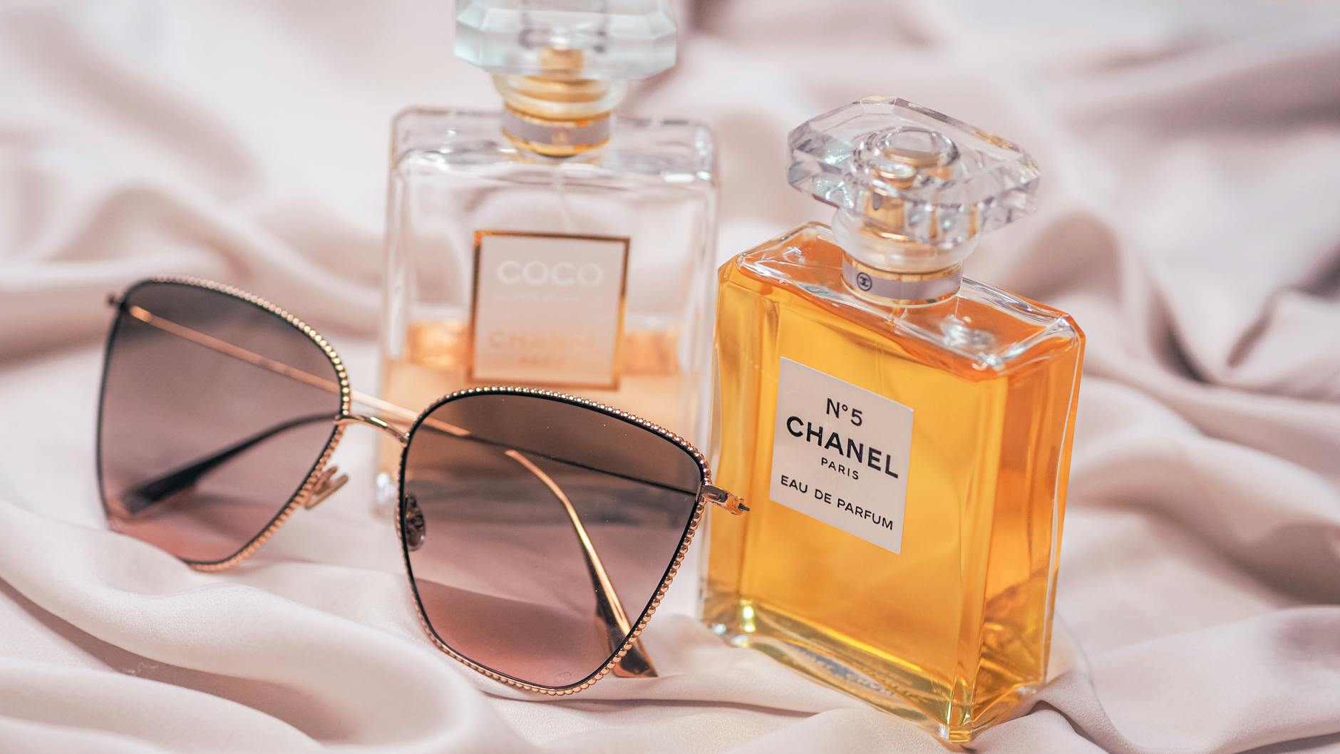 A collection of the best long-lasting perfumes for men in 2026, including luxury and affordable options, displayed on a sleek surface.