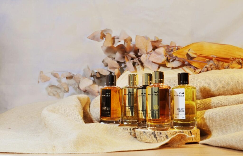 A visual guide to fragrance families: floral, woody, and oriental perfumes with examples and characteristics.
