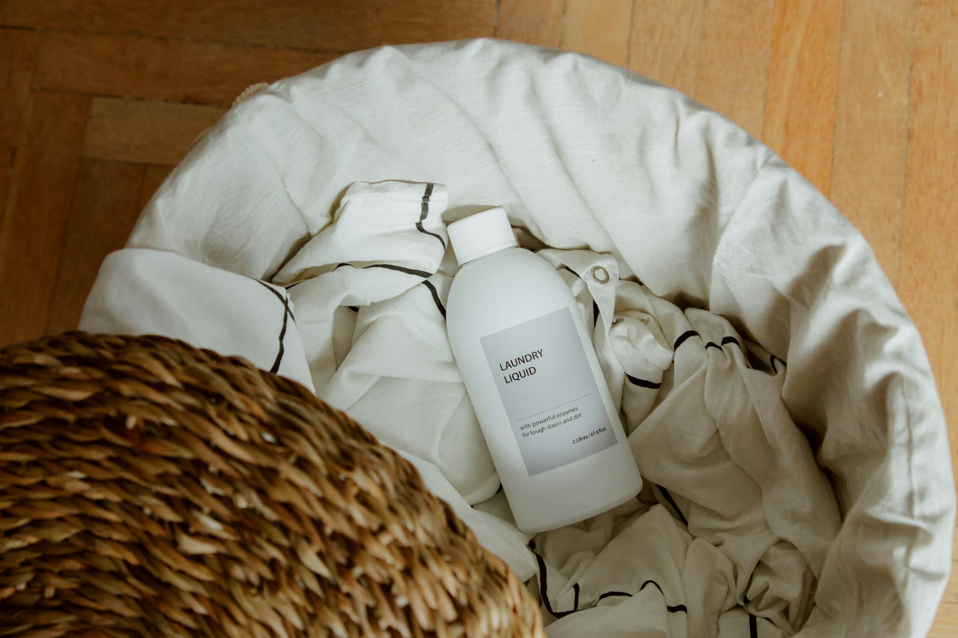 Collection of the best perfumes that smell like clean laundry, including luxury and affordable options, displayed with fresh linens and sunlight.