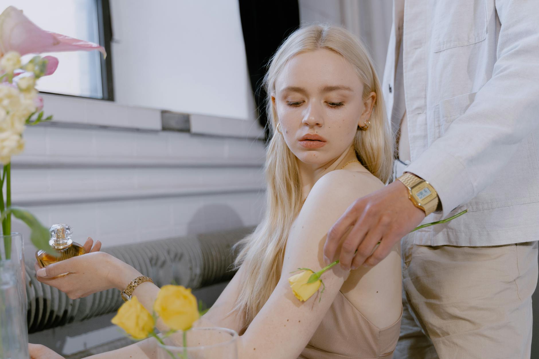 Man and woman wearing compliment-getting perfumes in a stylish setting