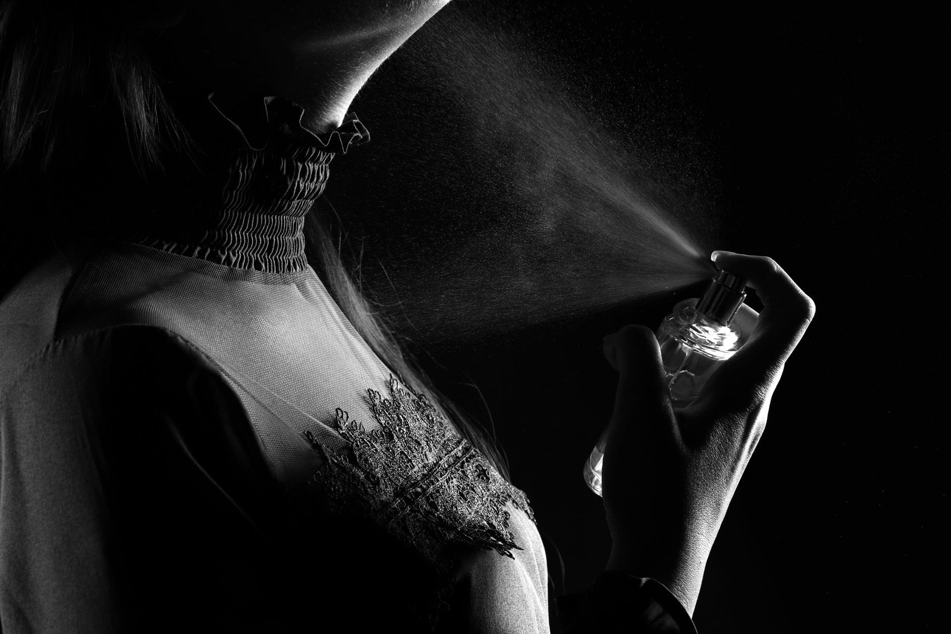 A woman selecting the best Amazon perfumes for women from a curated collection of luxury and affordable fragrances.