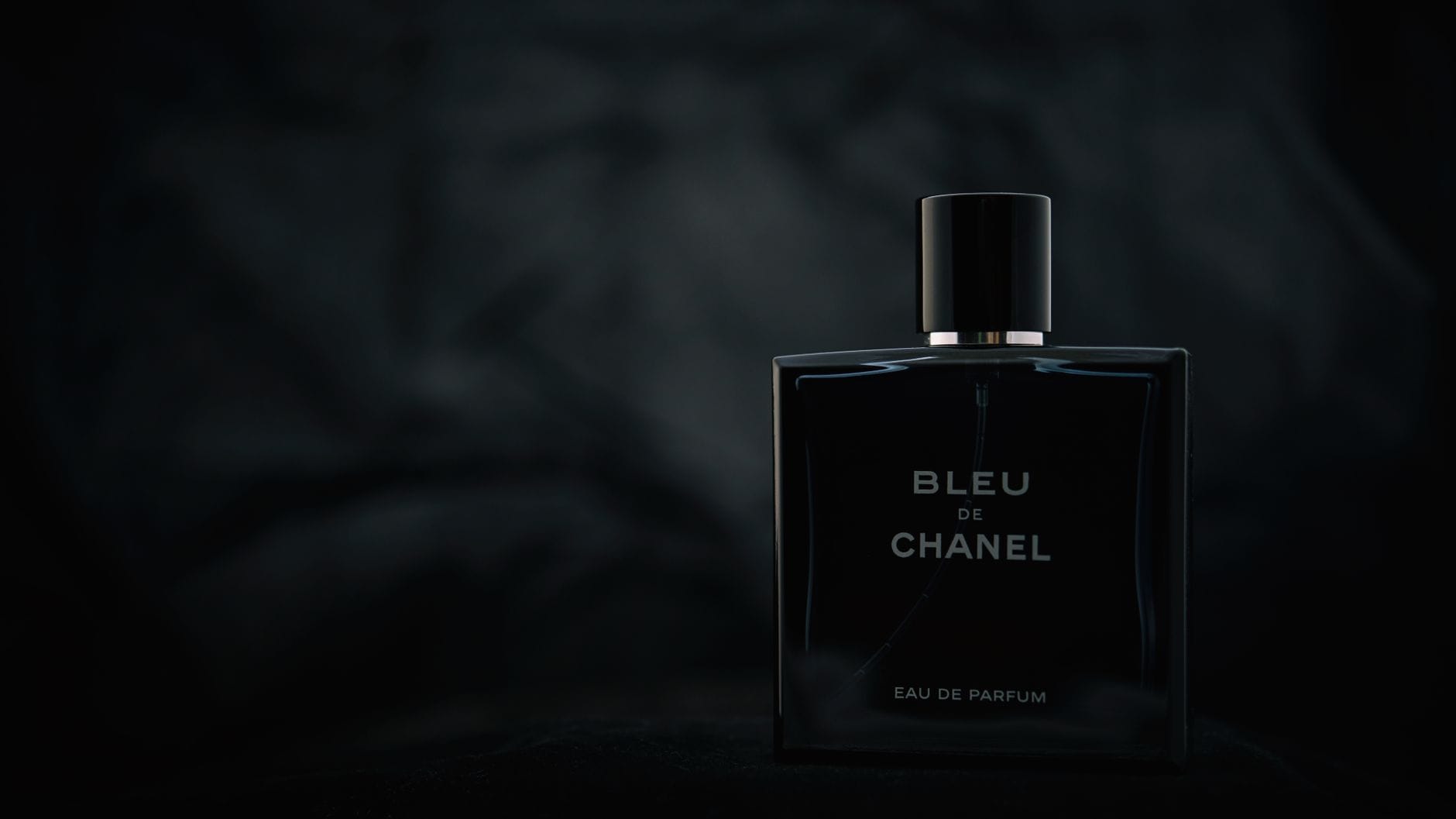 Collection of the best YSL perfumes for men in 2026, including La Nuit de L’Homme, Y EDP, and Kouros, displayed on a modern surface.