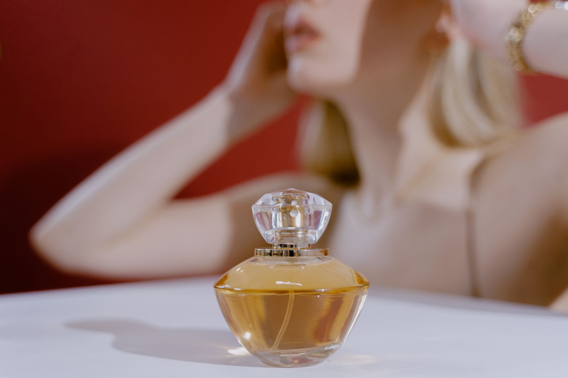 Elegant woman exploring fragrance notes in a luxury perfume boutique
