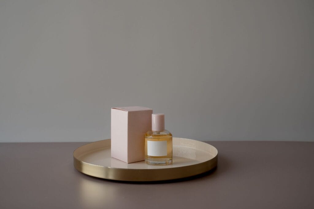 A collection of elegant and affordable perfume bottles arranged beautifully on a minimalist vanity, showcasing cheap perfumes that smell expensive.