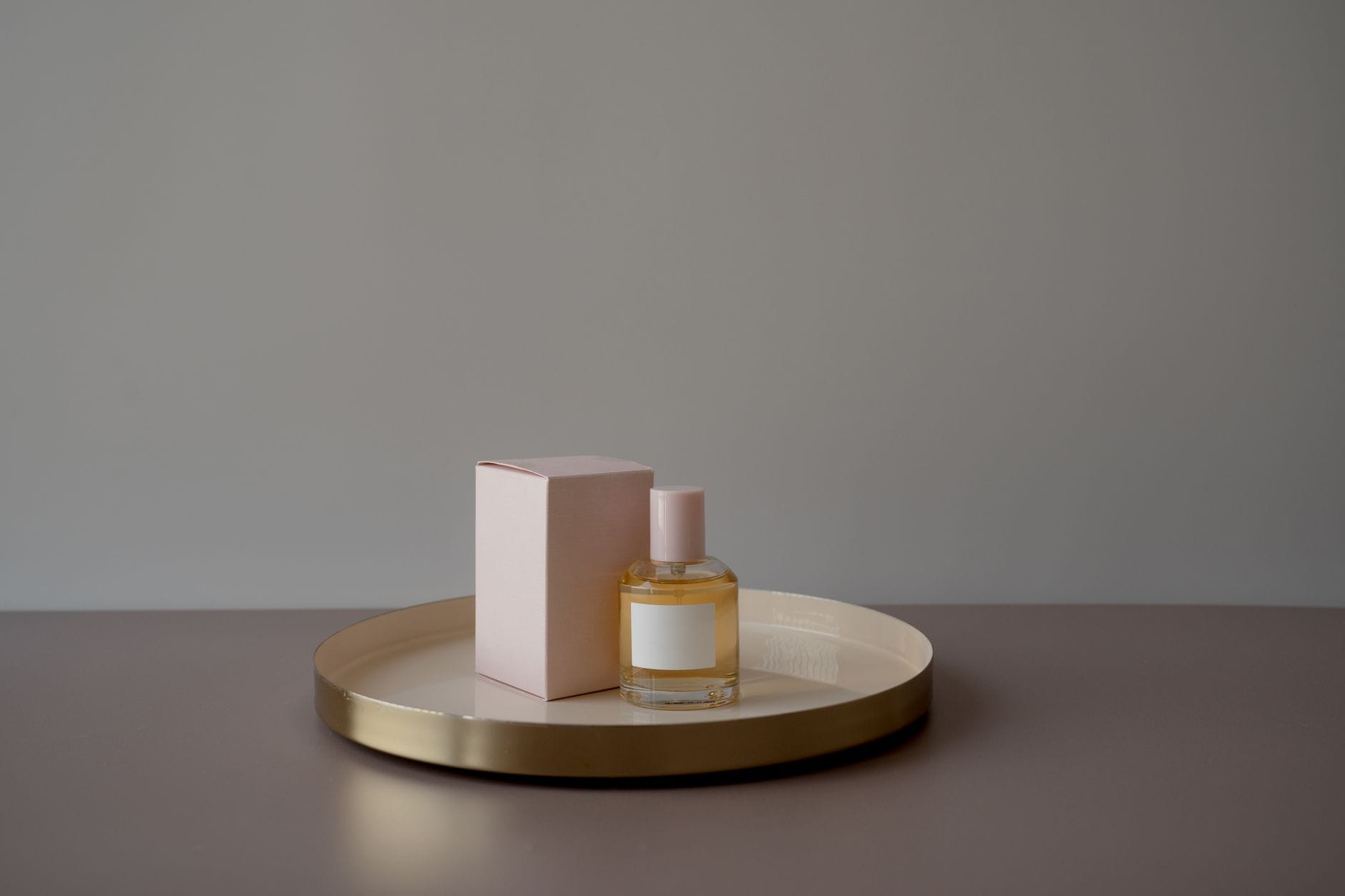 A collection of elegant and affordable perfume bottles arranged beautifully on a minimalist vanity, showcasing cheap perfumes that smell expensive.
