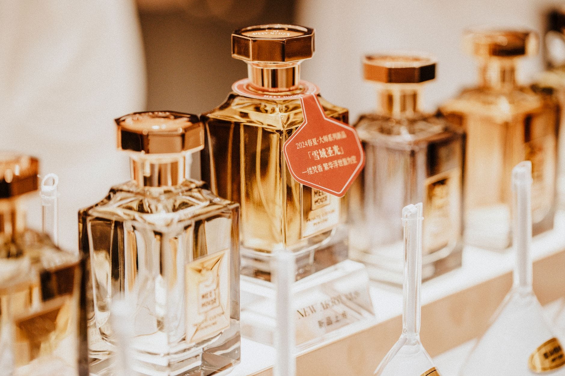 A collection of luxurious and ornate Arabic perfume bottles for women on an elegant vanity table