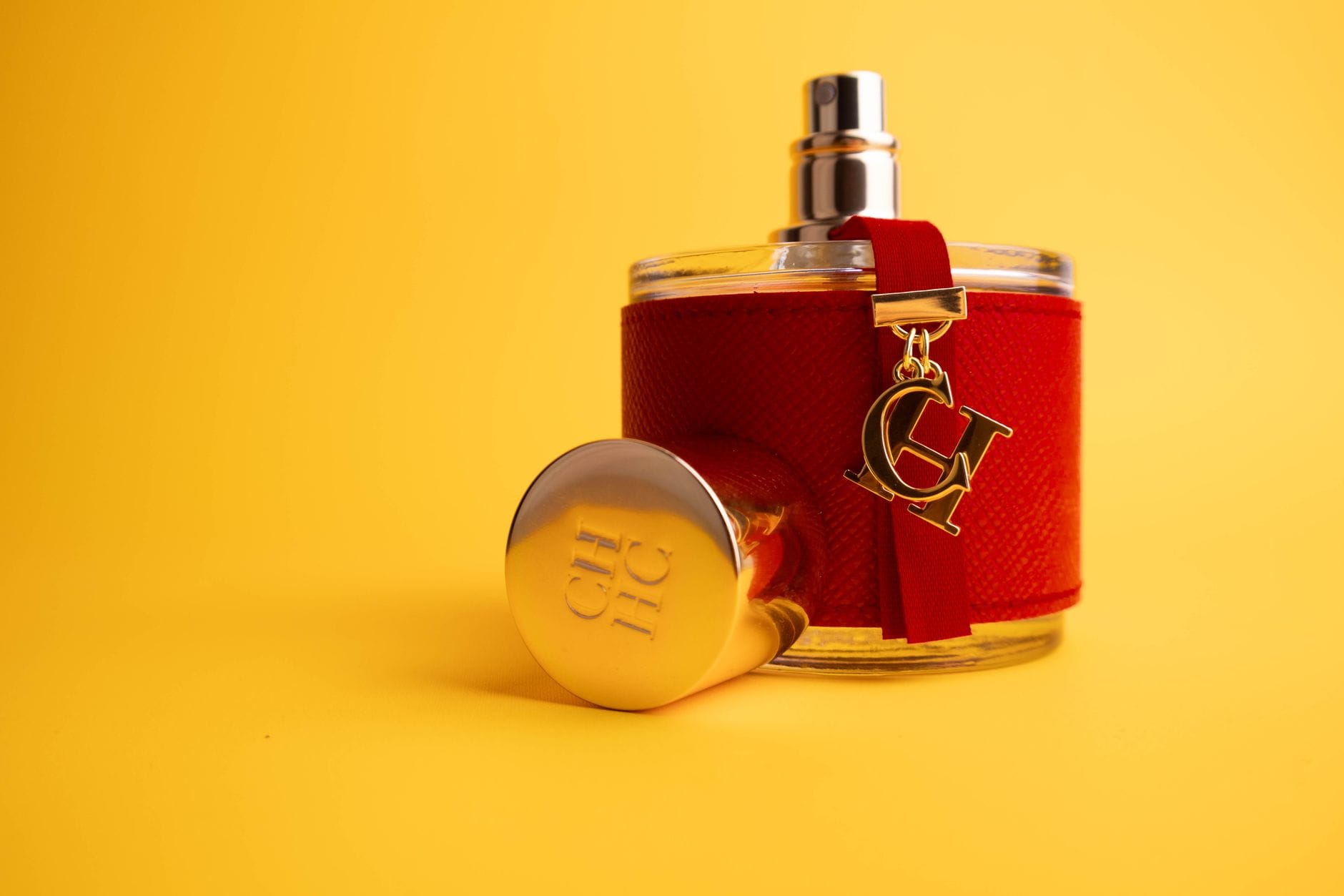 Luxury perfume bottle with gold accents representing high-end fragrances that smell like rich people
