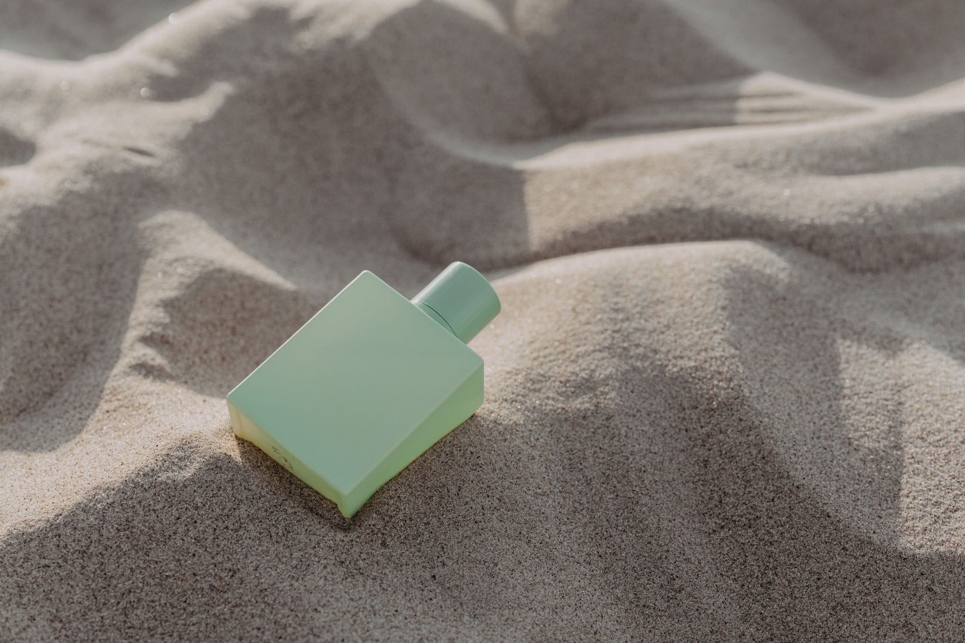 A collection of elegant and versatile everyday perfume bottles sitting on a clean vanity, bathed in soft morning light